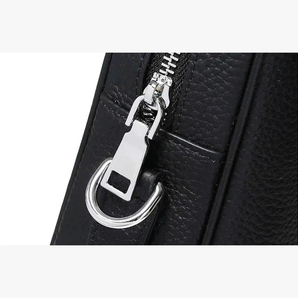 Détail de la fermeture éclair en métal sur le porte-documents en cuir rigide