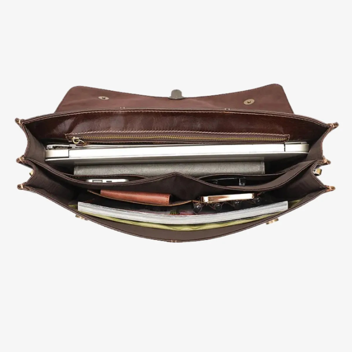 Vue de dessus du porte-documents cuir vachette avec laptop et accessoires organisés